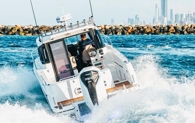 white honda boat engine anchored on a white fishing boat